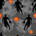 Basketball player on gray grunge background and orange ball. Royalty Free Stock Photo